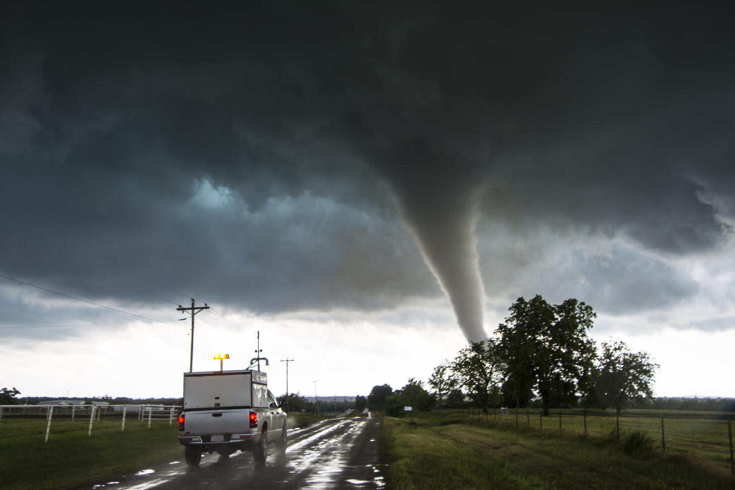 Storm vehicle with the Center for Severe Weather Research driving into the path of tornado with winds of 166 to 175 miles per hour, in Katie, Oklahoma