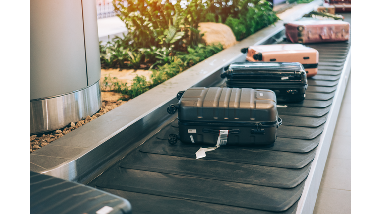 Suitcase or luggage with conveyor belt in the international airport.