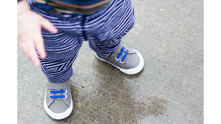 Little Boy Walking in the Rain