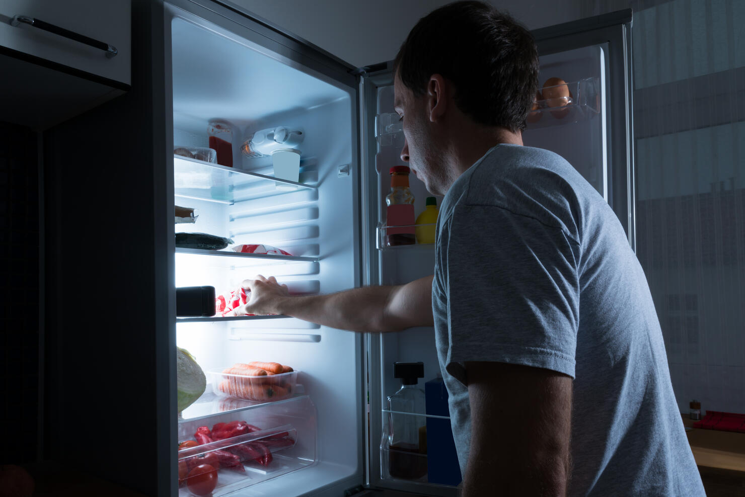 Man Taking Food From Fridge