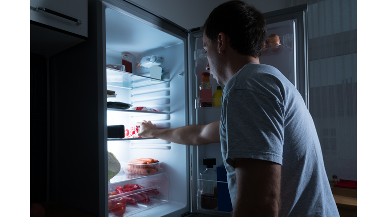 Man Taking Food From Fridge