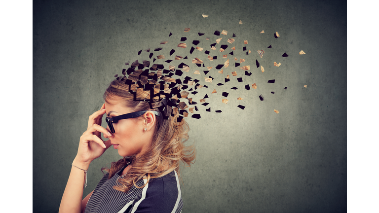Woman losing parts of head as symbol of decreased mind function.