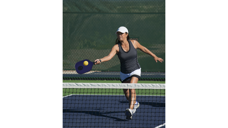 Pickleball - Female Player Hitting Forehand Shot