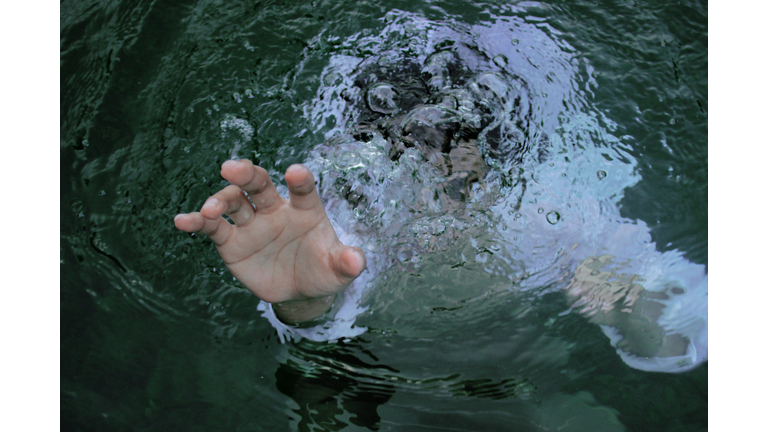 High Angle View Of Man Drowning In River