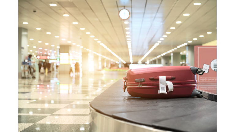 Luggage On Conveyor Belt At Airport