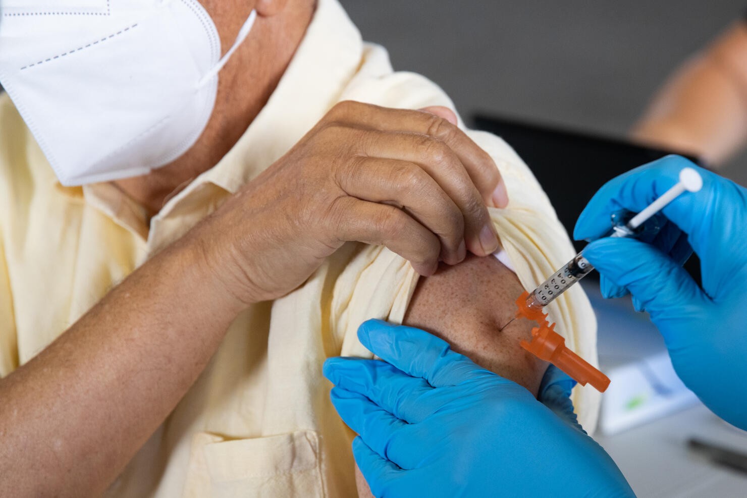Americans Receive Booster Shots Of COVID-19 Vaccination In Michigan