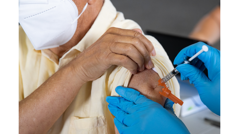 Americans Receive Booster Shots Of COVID-19 Vaccination In Michigan