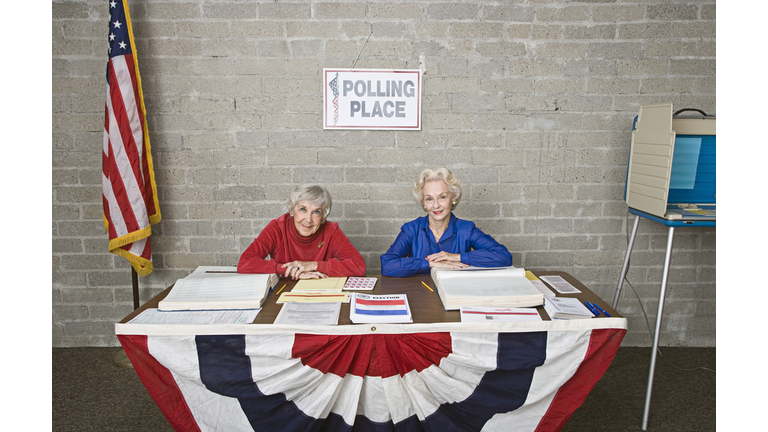 Senior women at polling place table