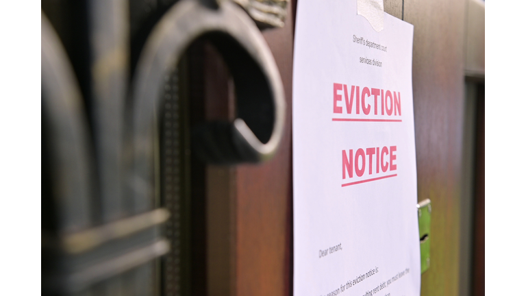 the notice of eviction of tenants hangs on the door of the house