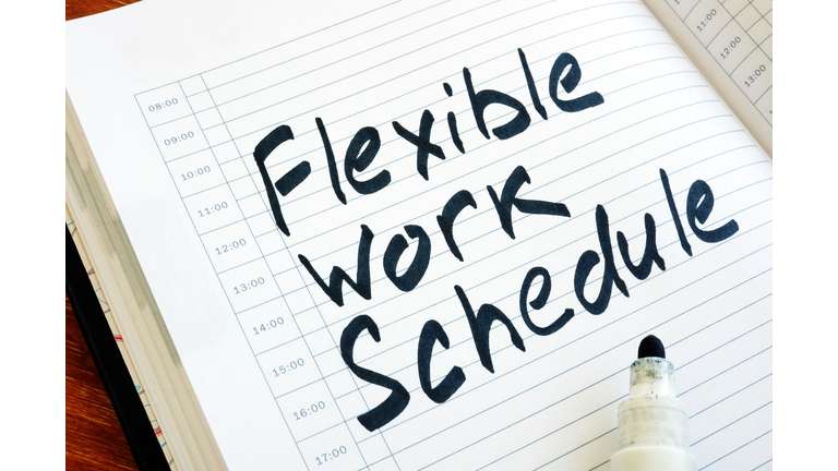 Flexible Work Schedule sign in the notepad.