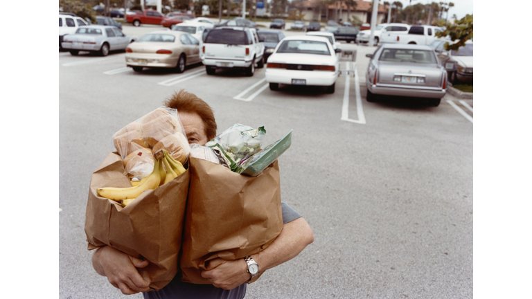 Man Carrying Grocery Bags