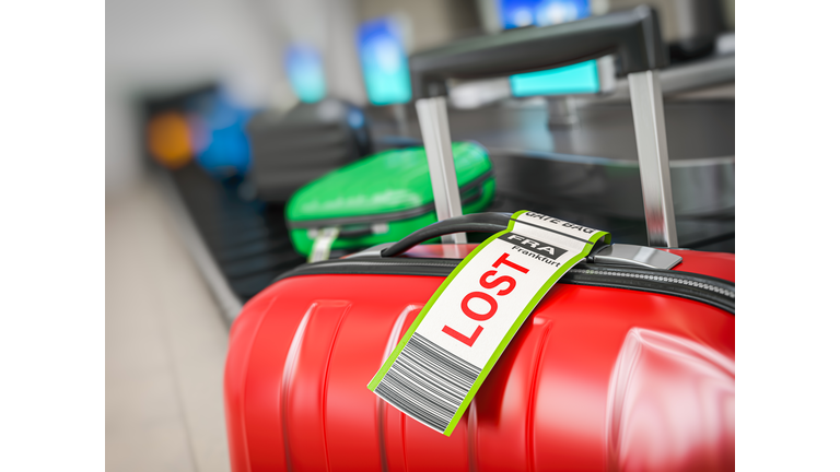 Suitcase with lost sticker on an airport baggage conveyor or baggage claim transporter.