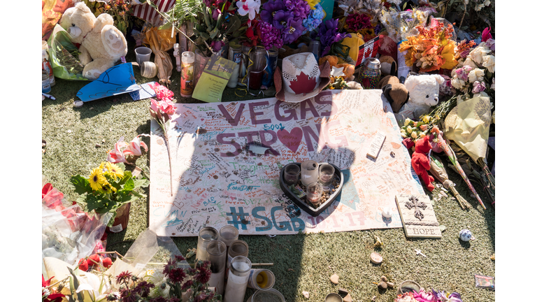 Flowers, gifts candles line memorial park at the Welcome to Las Vegas sign by the Mandalay Bay on the Vegas Strip to remember the victims killed in the Las Vegas attack