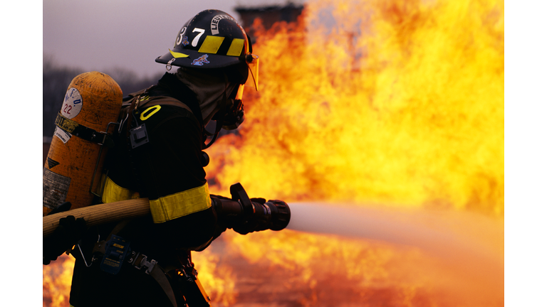 Firefighter Battling Flame