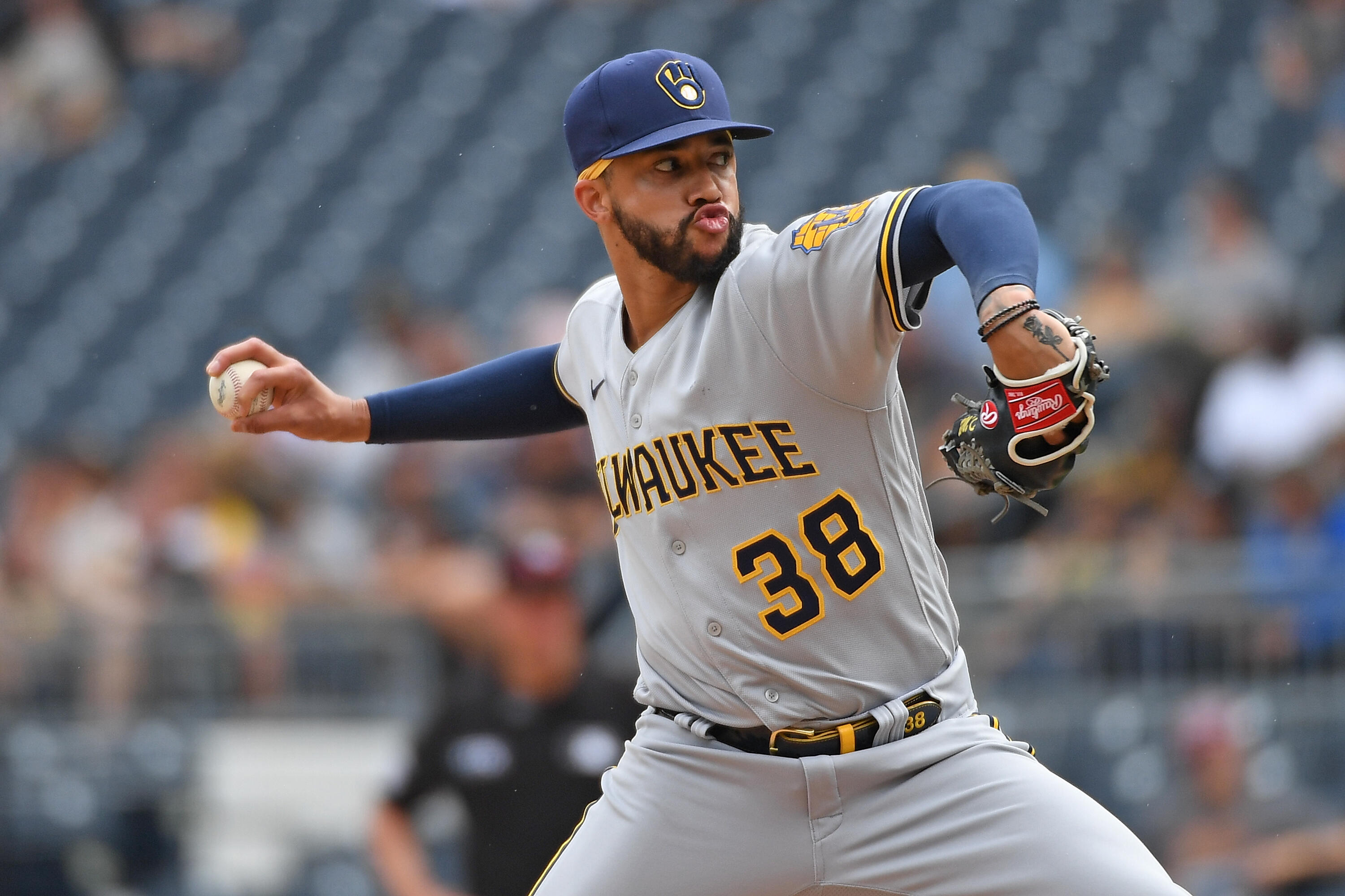 Brewers top setup man likely to miss postseason after he 'punched a wall' –  KNBR