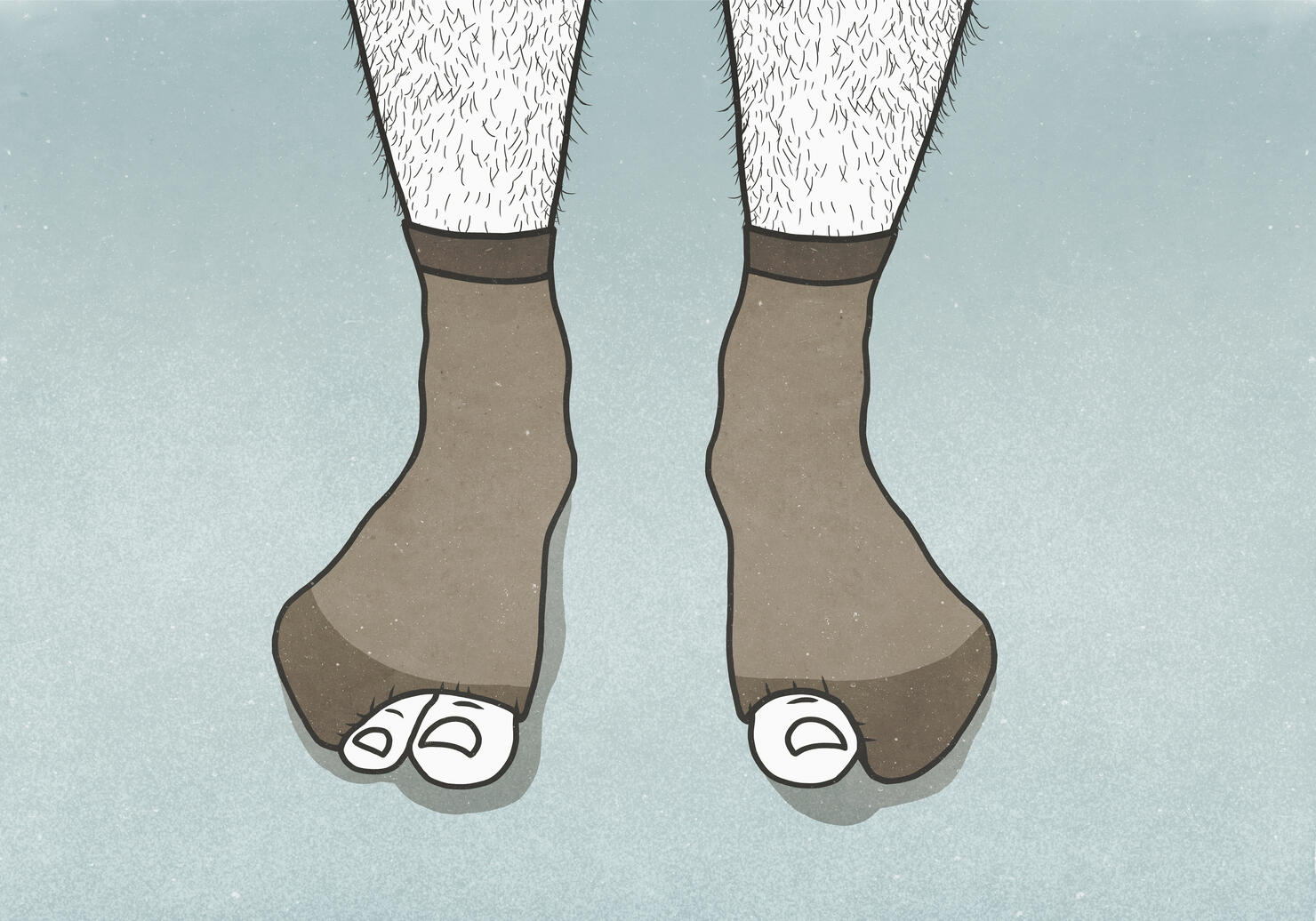 Big toes sticking out of holes in mans socks