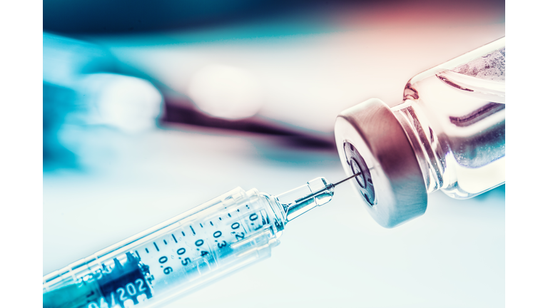 Close-up medical syringe with a vaccine.