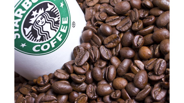 Starbucks cup with coffee beans