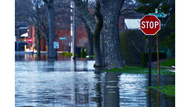 Flooded residential street at a stop sign