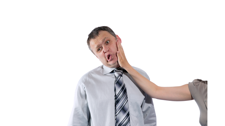 Woman hand slapping man's face