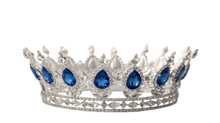 Beauty pageant winner, bride accessory in wedding and royal crown for a queen concept with a silver tiara covered in crystals, diamond and blue sapphire stones isolated on white with clip path cutout