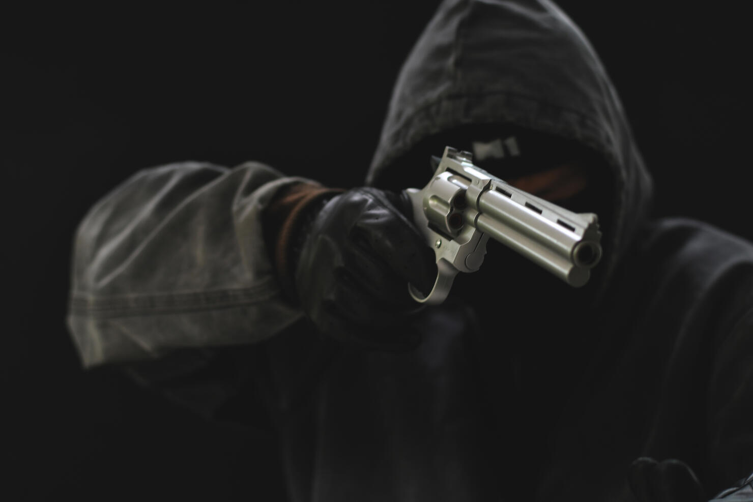 Masked Armed robbers pointing a handgun to robbery the money, Uses Gun in Armed Robbery, Gun Point , used for the illustration or montage of your design, Banner for advertise of product