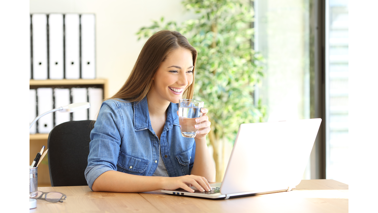 Entrepreneur working and drinking water