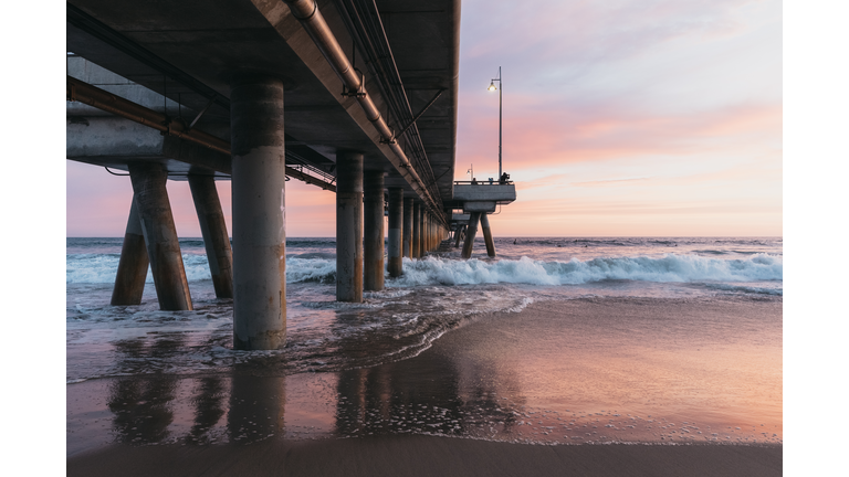 Beautiful sunset on beach next to Venice Pier in California