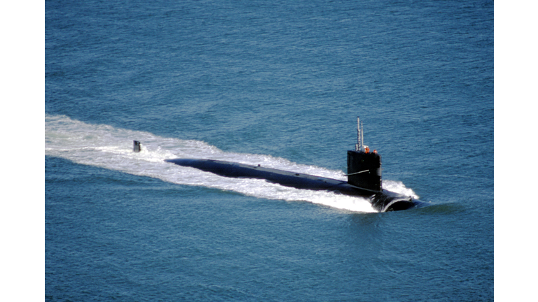 High Angle View Of Navy Submarine In Sea Against Sky