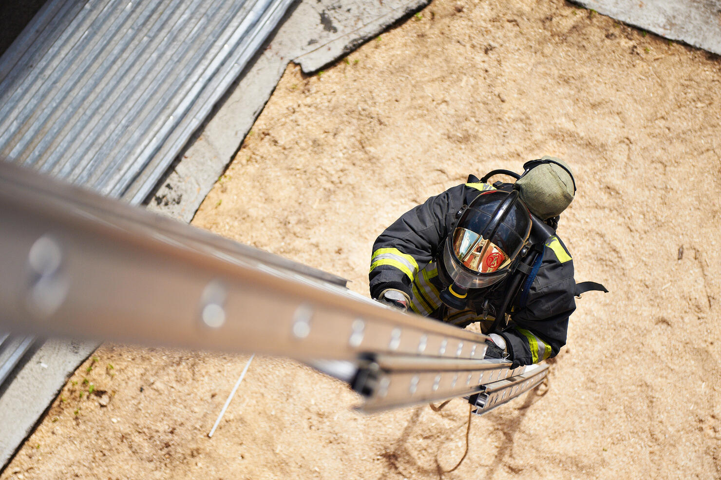 Firefighter in training with the fire stairs