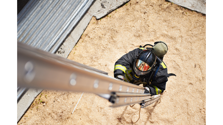 Firefighter in training with the fire stairs