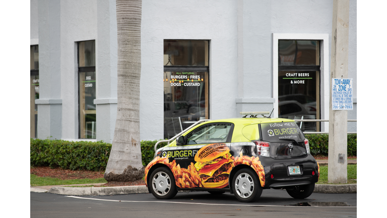 Stock photo Burgerfi Delivery vehicle with wrapped advertising