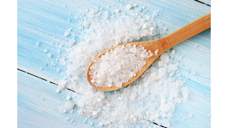 Sea salt on wooden table wooden spoon