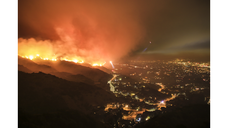 Rescue teams evacuating neighborhood from wildfire