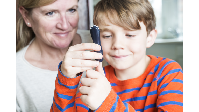 Juvenile diabetes patient with his mother