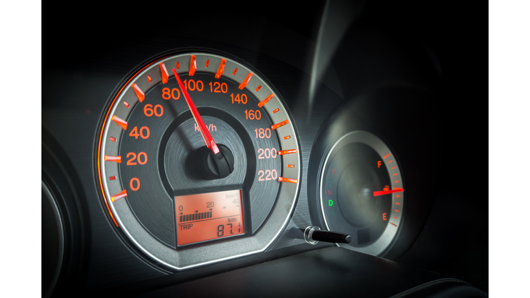 Closeup car dashboard. Speeding on 80 km per hour. Safety speeding. Detail of transportation.