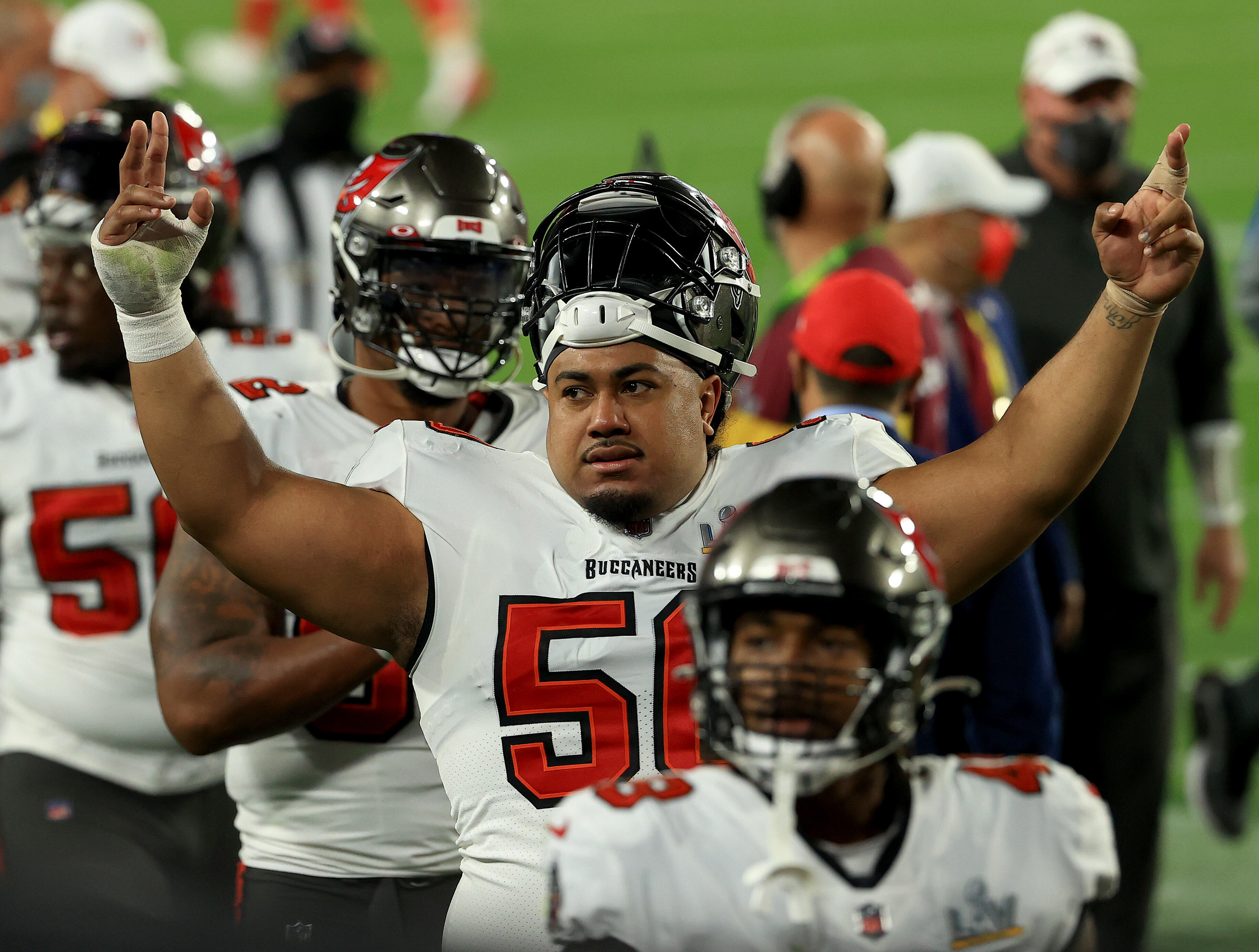 Vita Vea has a hard time swapping jerseys