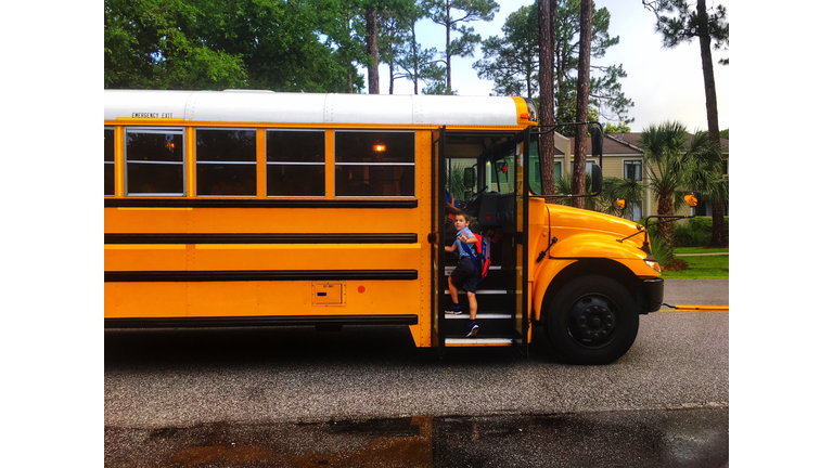 Student Boarding School Bus In City