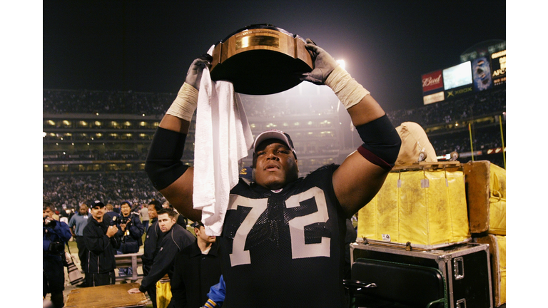 Lincoln Kennedy with Lamar Hunt Trophy