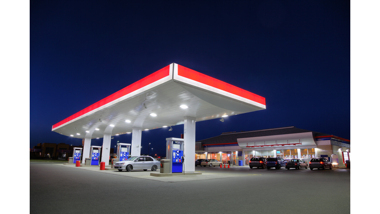 Car Refueling at Gas Station during the Night