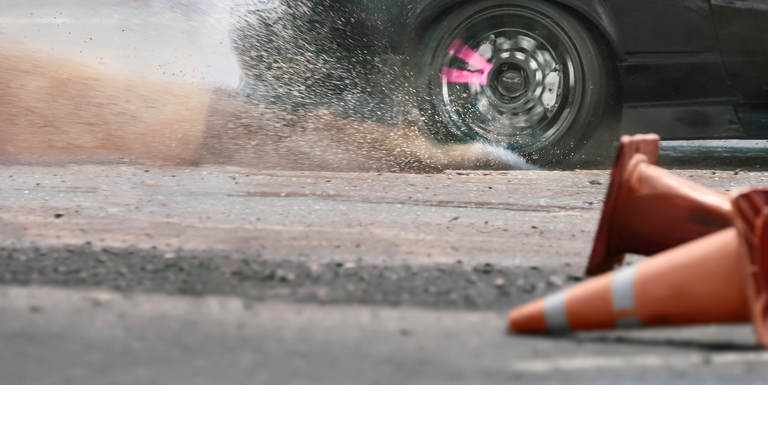 Close up drift race car increasing speed on drift playground