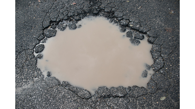 Pot hole filled with rain water