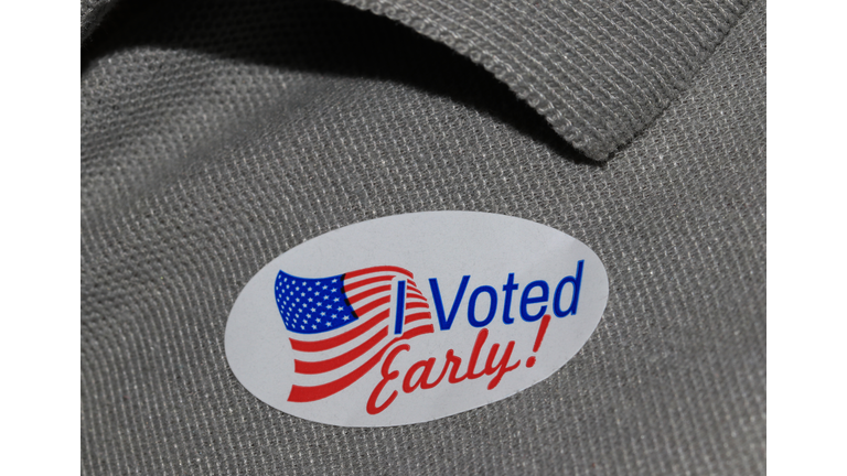 Early voting sticker on a gray shirt close up