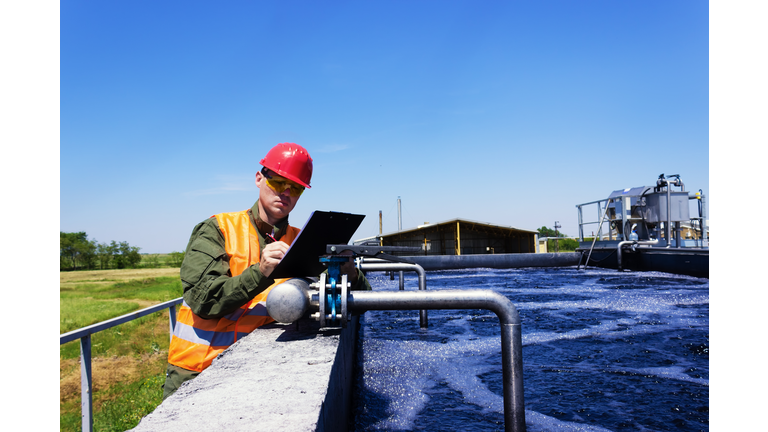 Worker inspecting valve