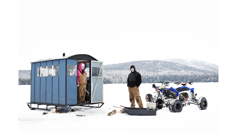 COUPLE ICE FISHING IN MAINE