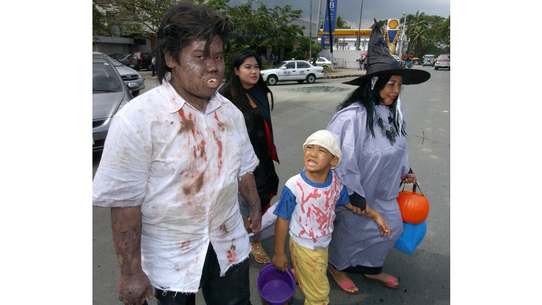 Filipinos Sho Komari (L), his sister Ber Trick-or-Treating