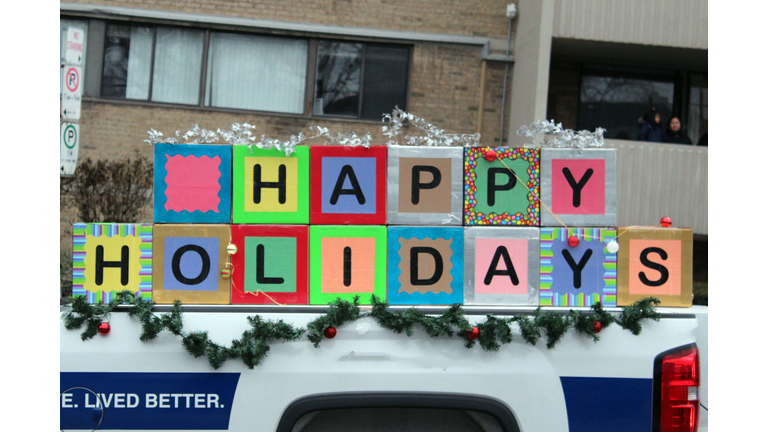 Happy holidays arrangement in a pickup truck