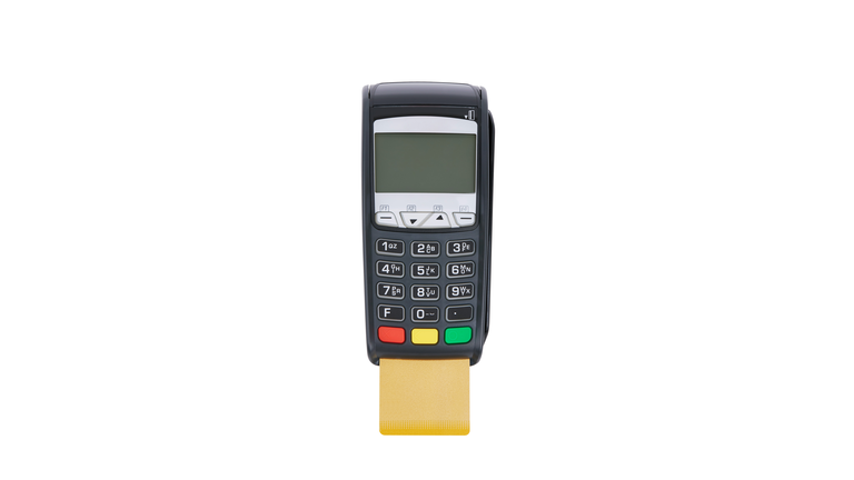 Credit card reader with golden credit card isolated on white background.