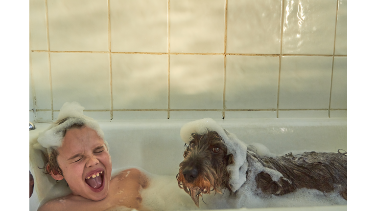 Portrait of young boy and his dog