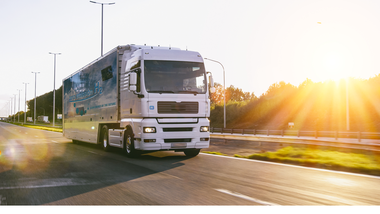 Truck with hydrogen logo. h2 combustion engine for emission free ecofriendly transport.